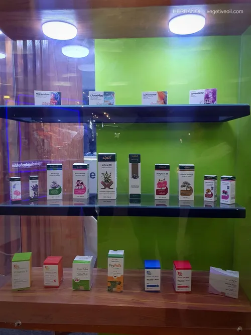 Shelves displaying herbal medicine boxes, syrups, and vitamin supplements
