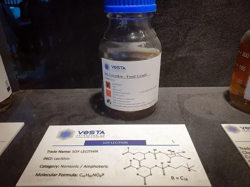 Close-up of a Vesta soy lecithin sample bottle and molecular formula card