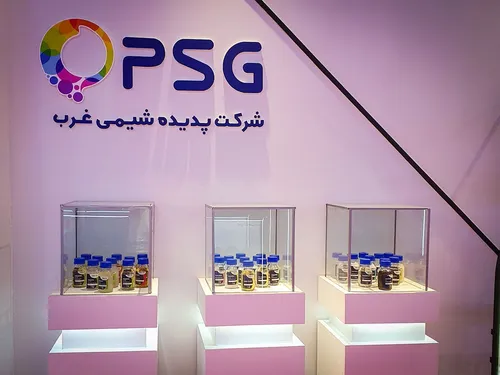 PSG branded booth wall above pink plinths with sample bottle cases