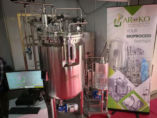 Close view of stainless steel fermentation vessel and Aroko banner