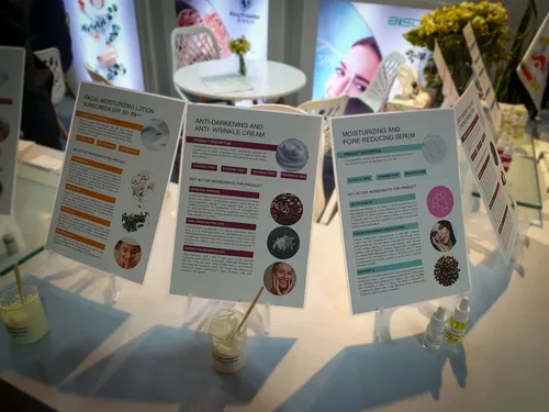 Three skincare product information cards displayed with sample beakers