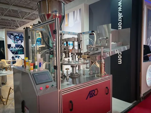 ARO tube filling machine with cosmetic tubes at a booth