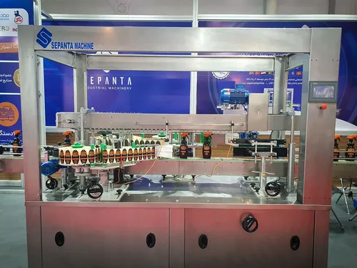 Sepanta Machine labelling line applying labels to spray bottles