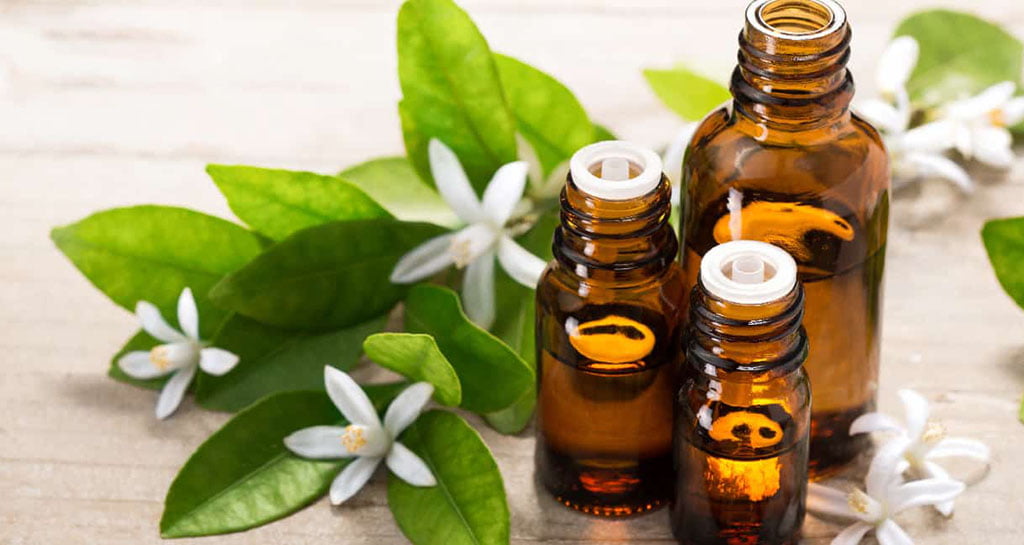 Neroli Essential Oil With Fresh White Neroli Flowers